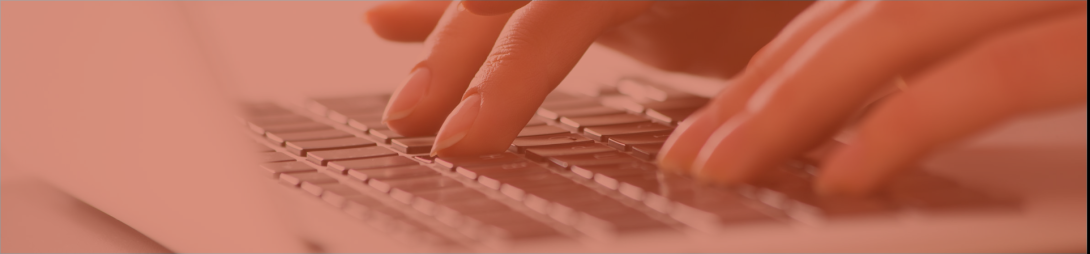 Fingers typing on a laptop keyboard